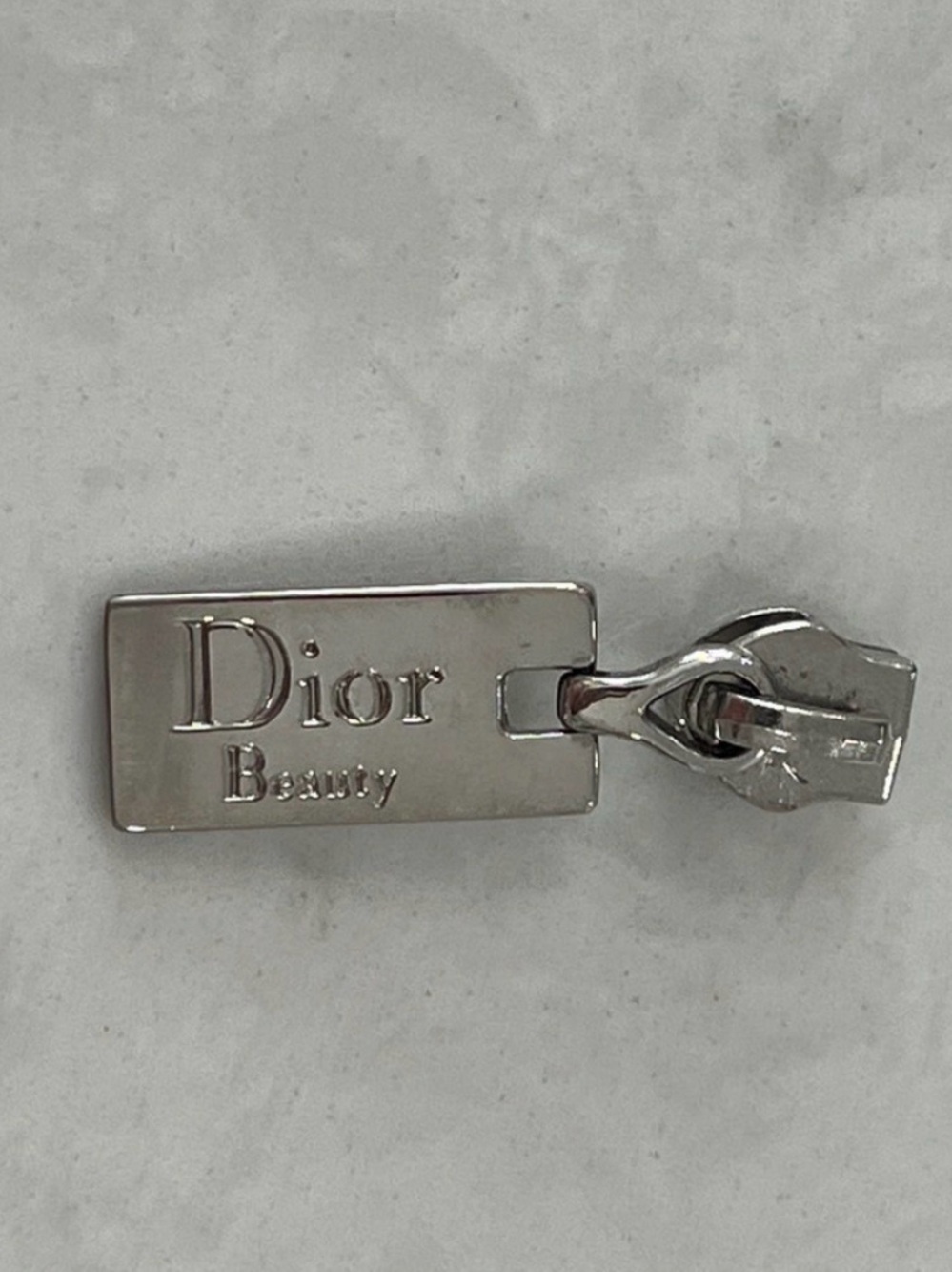 Dior embossed Dior beauty Silvertone metal zipper pull